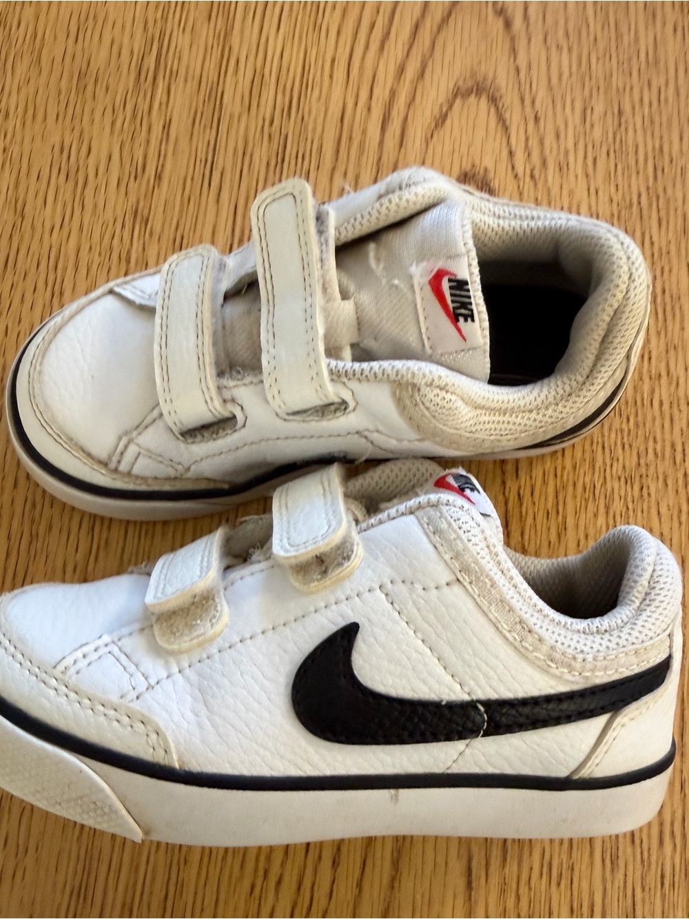 Nike Kids White Sneakers with Black Swoosh and Velcro Straps
